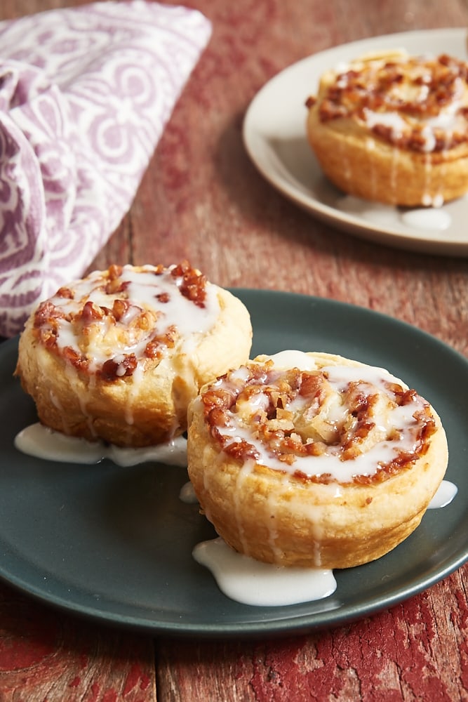 Berry Cream Cheese Pastry Swirls on a dark gray plate