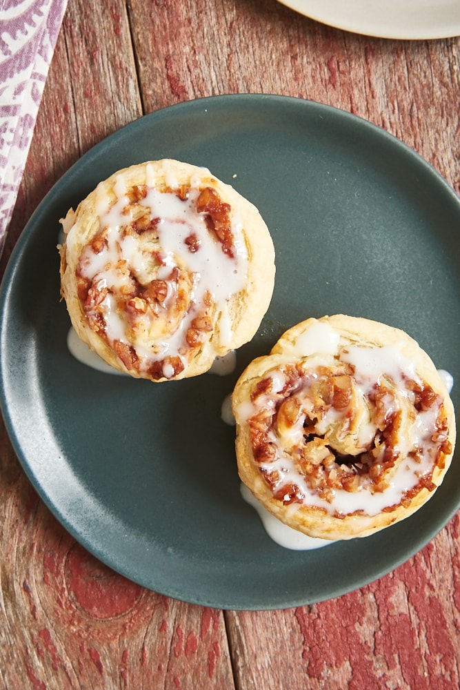 overhead view of Berry Cream Cheese Pastry Swirls on a dark gray plate