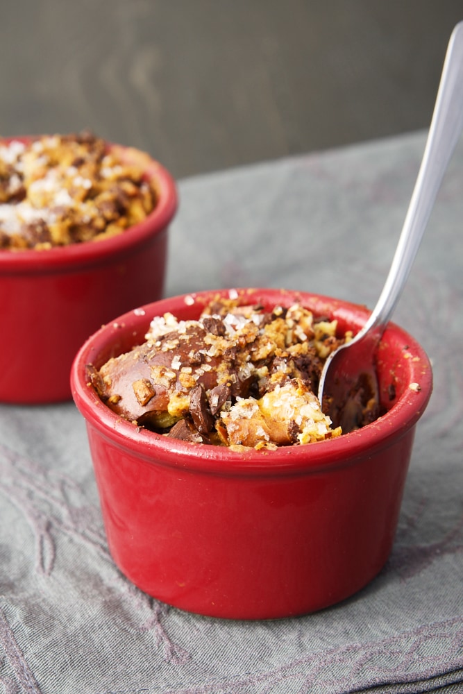 Dark Chocolate Bourbon Bread Puddings in red ramekins