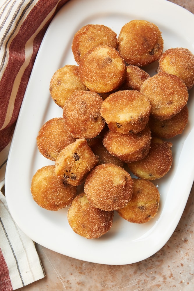 overhead view of Mini Chocolate Chip Doughnut Muffins on a white platter