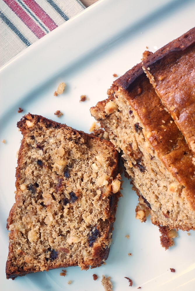 overhead view of Hazelnut Date Bread on a white plate