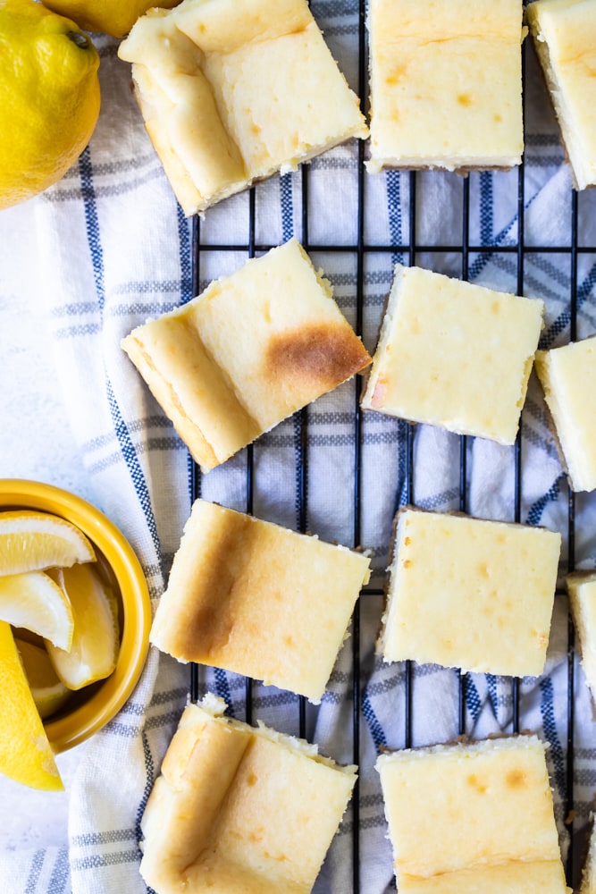 overhead view of Limoncello Cheesecake Squares on a wire rack