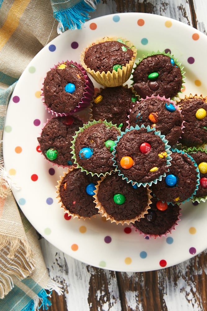 overhead view of M&M Brownie Bites on a multi-colored polka dot plate