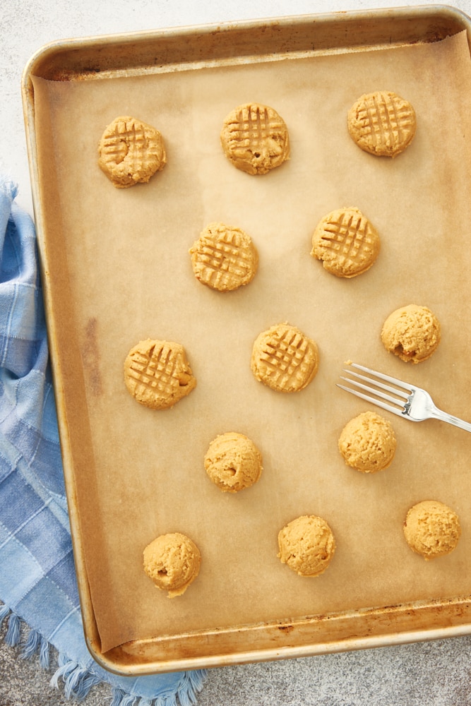 Peanut Butter Cookies dough on a parchment-lined baking sheet