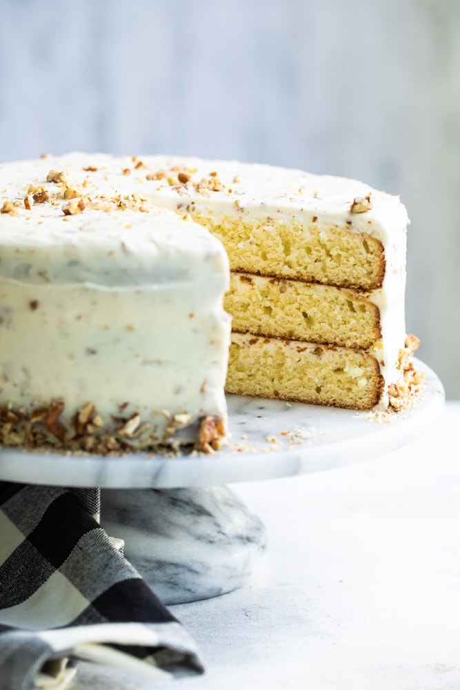 Butter Pecan Cake on a marble cake stand