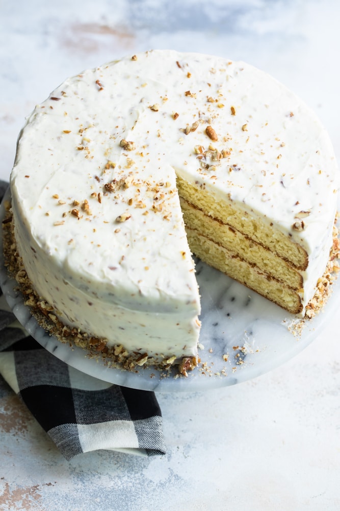 Butter Pecan Cake on a marble cake stand