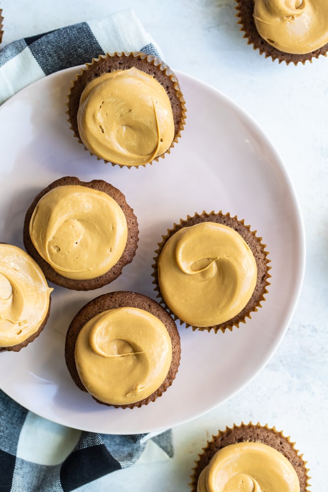 overhead view of Mexican Chocolate Cupcakes with Dulce de Leche Frosting on a white plate