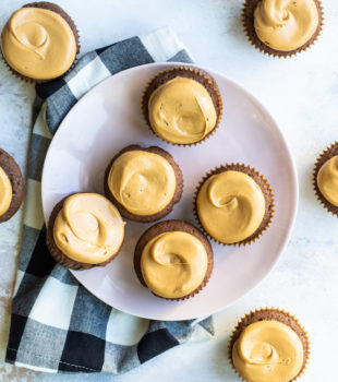 Overhead view of Mexican chocolate cupcakes on plate and tabletop
