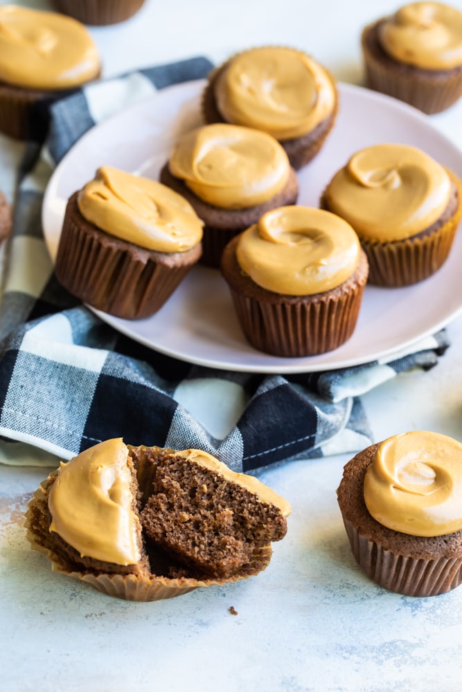 Mexican Chocolate Cupcakes on a white plate and a light-colored surface