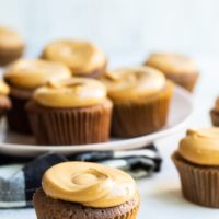 Mexican Chocolate Cupcakes with Dulce de Leche Frosting on a light-colored surface