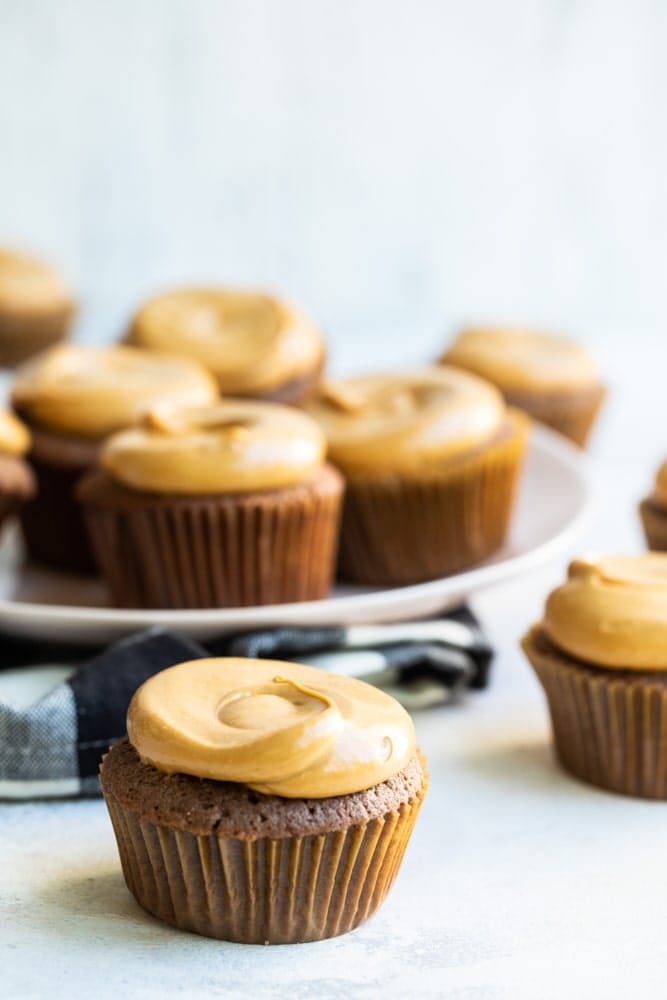 Mexican Chocolate Cupcakes with Dulce de Leche Frosting on a light-colored surface