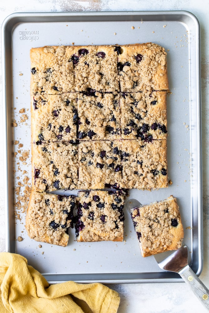 Overhead view of blueberry crumb cake on a baking sheet