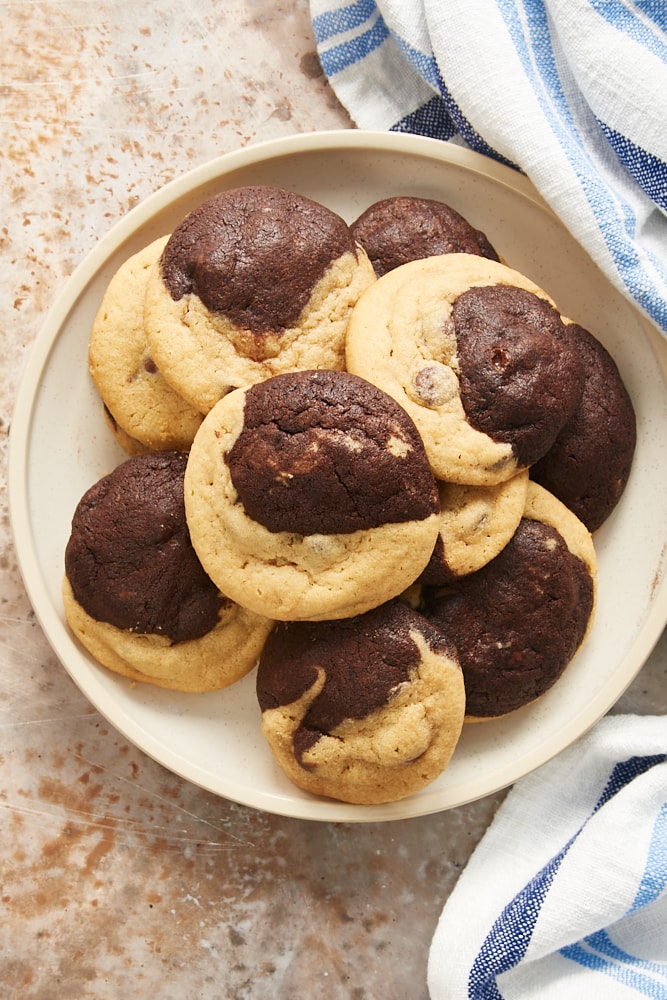 overhead view of Chocolate Peanut Butter Swirl Cookies on a beige plate