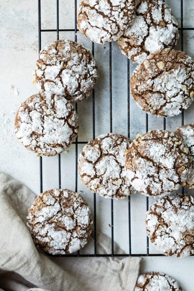 Overhead view of hazelnut crinkle cookies on a wire rack.