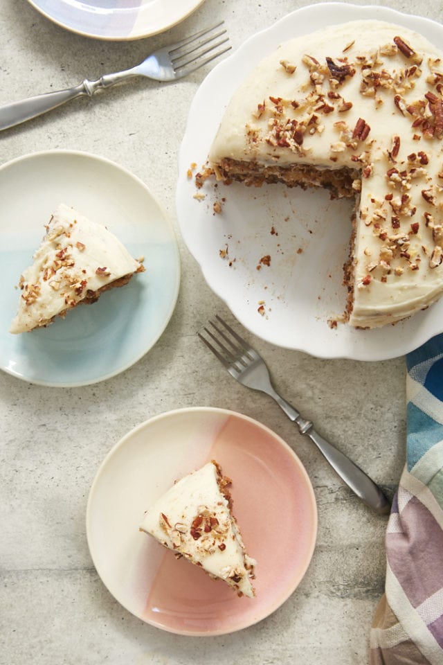 overhead view of slices of  6-Inch Hummingbird Cake on colorful plates