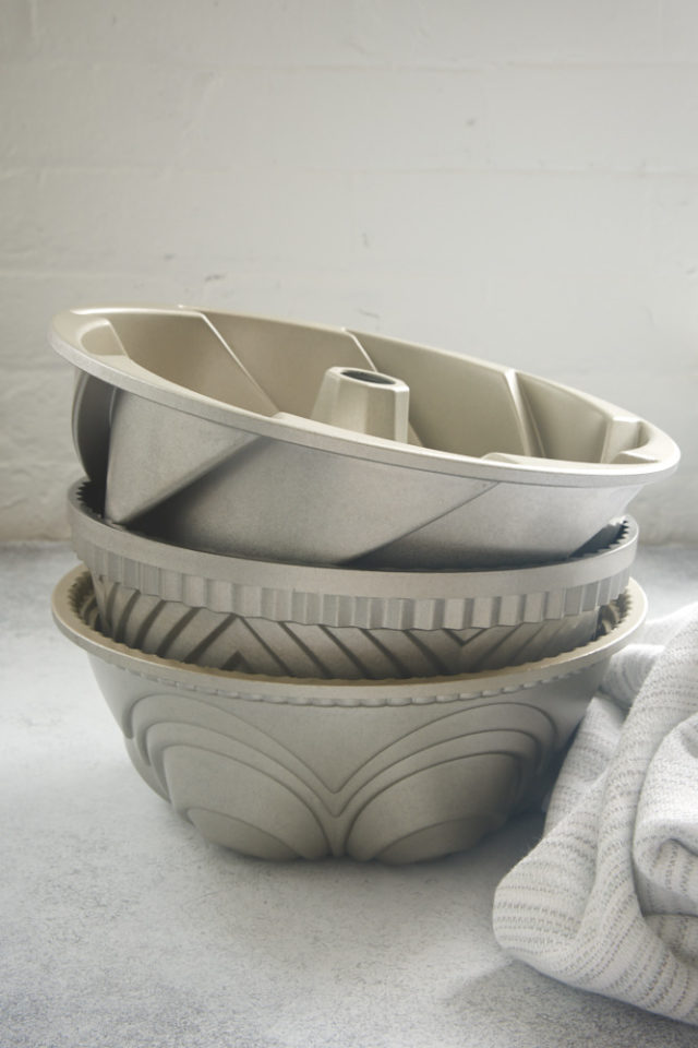 stack of Bundt pans on a gray surface