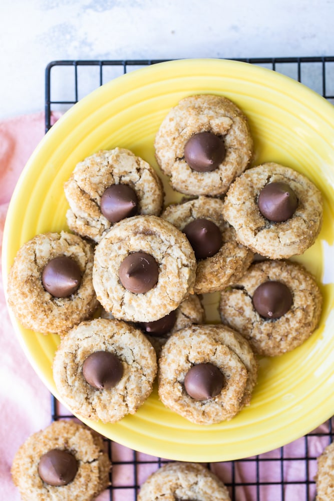 overhead view of Chocolate Caramel Kiss Cookies on a yellow plate