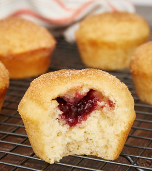 a peek at the jam filling in a doughnut muffin