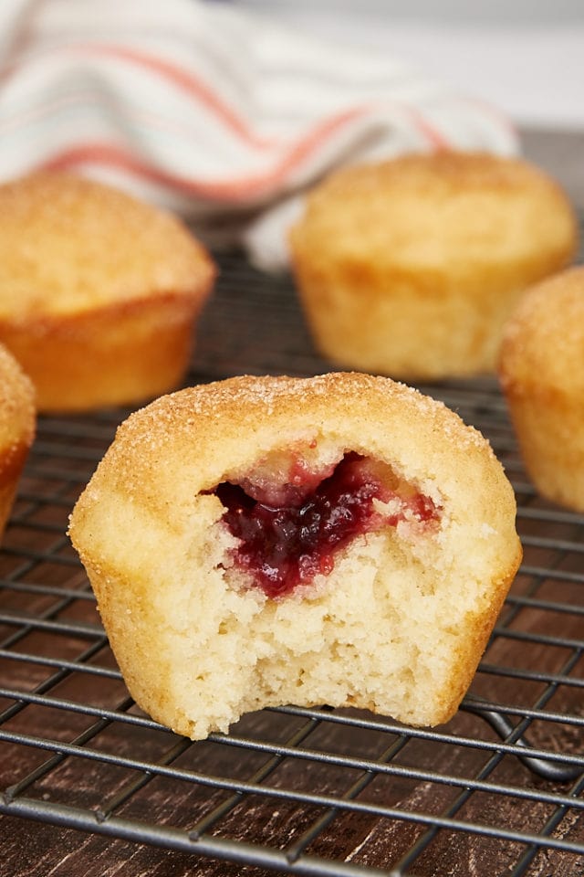 a peek at the jam filling in a doughnut muffin