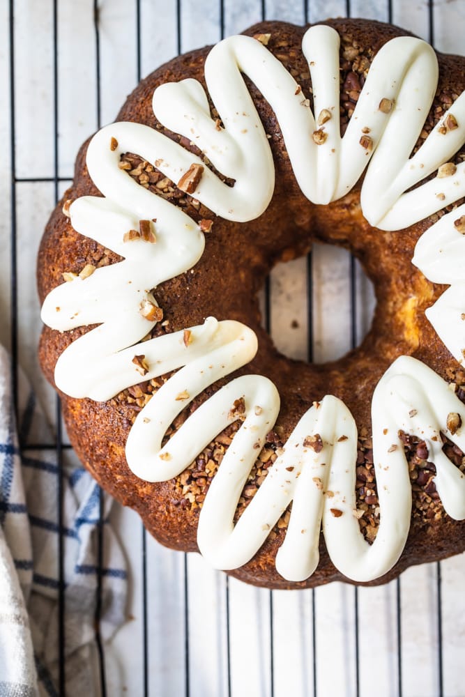 Overhead view of whole hummingbird Bundt cake on wire rack