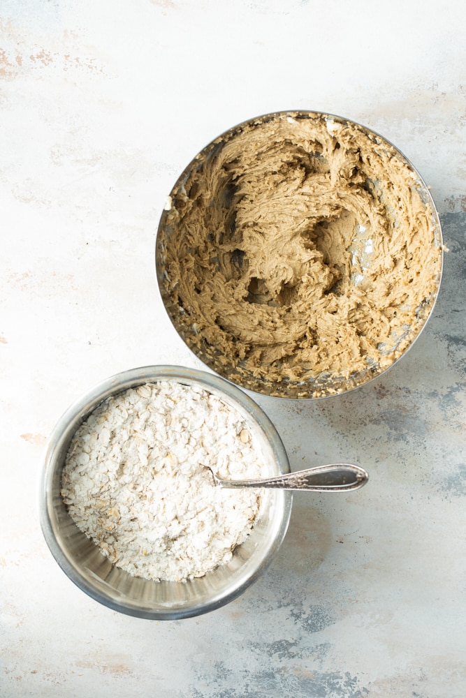 Overhead view of dry crust ingredients and creamed butter and sugar in bowls