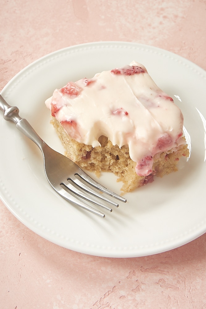 slice of Strawberry Sheet Cake on a white plate