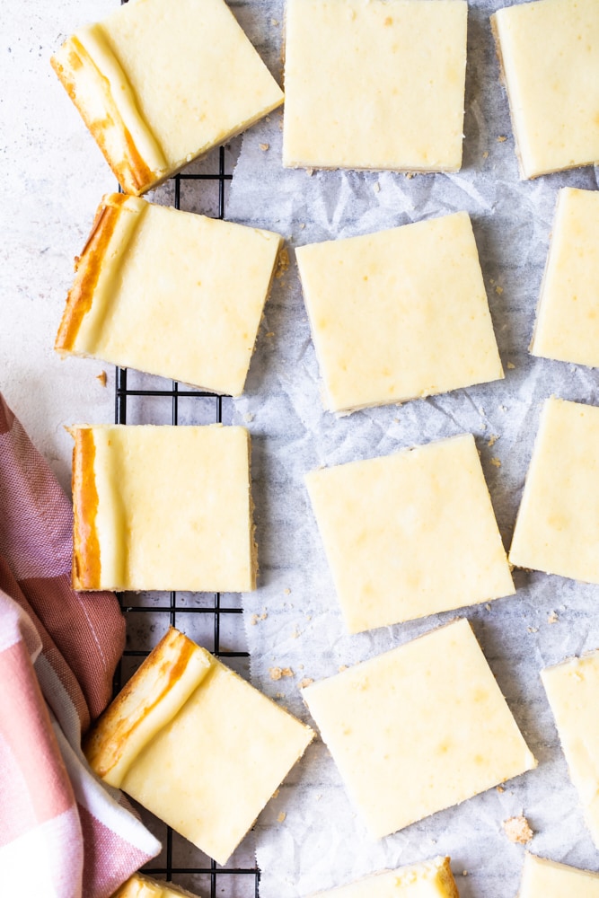 overhead view of Vanilla Bean Cheesecake Bars on a wire rack