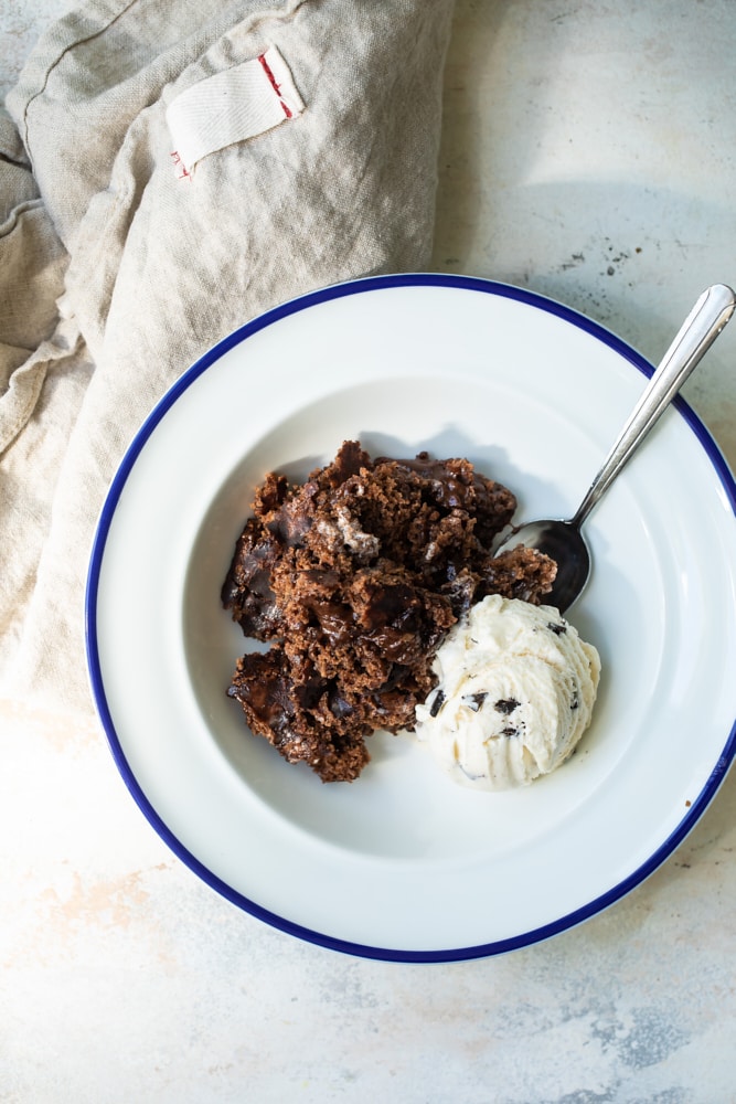 Brownie Chocolate Pudding Cake in bowl with ice cream