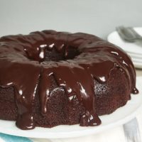 Chocolate Sour Cream Bundt Cake on a white cake stand