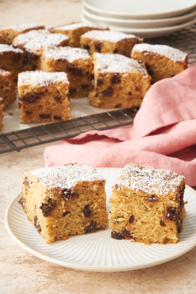 Chocolate Chip slices of Cookie Butter Snack Cake on a white and beige plate