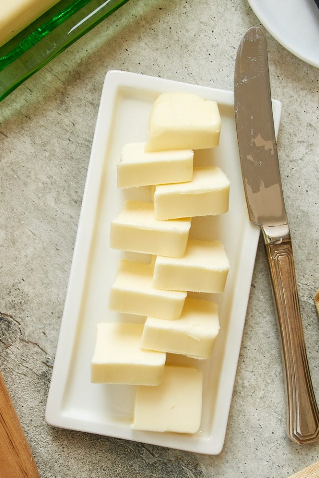 overhead view of butter on a white plate