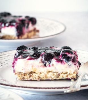 slice of Blueberry Jamboree on a white and gray plate