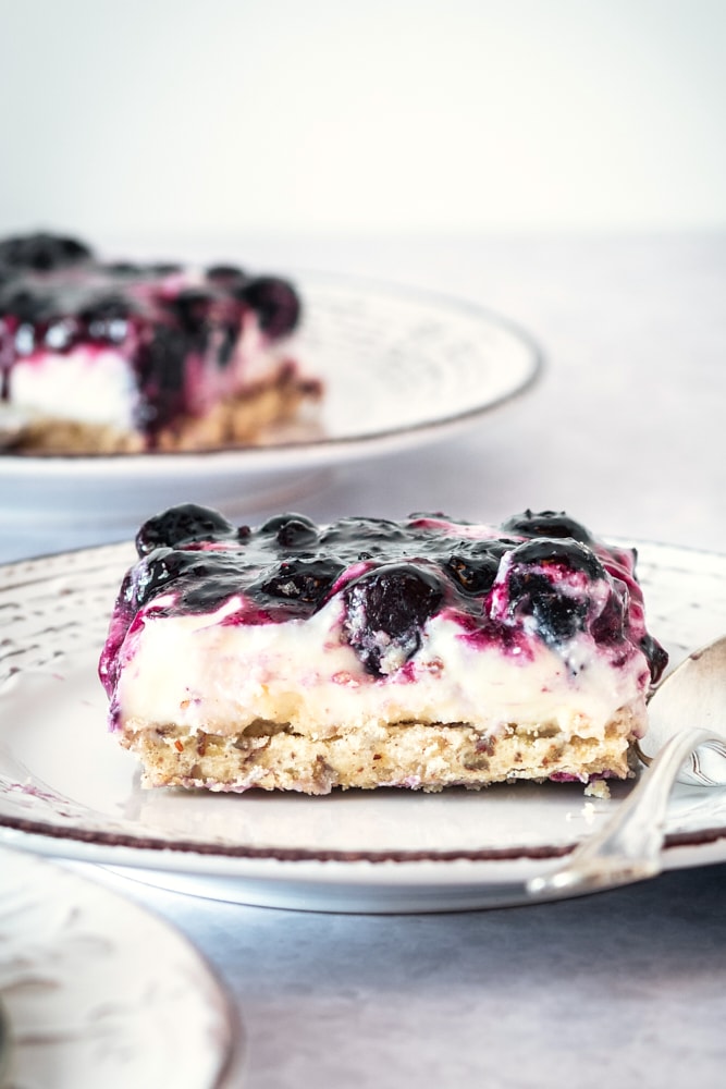 slice of Blueberry Jamboree on a white and gray plate