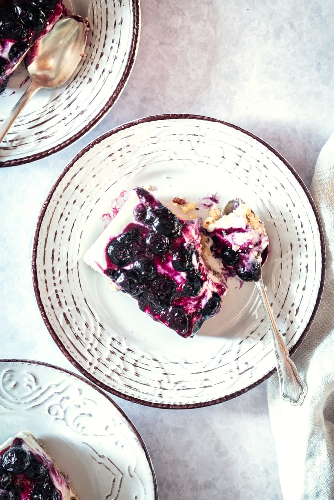 Overhead view of blueberry jamboree on plate with spoon