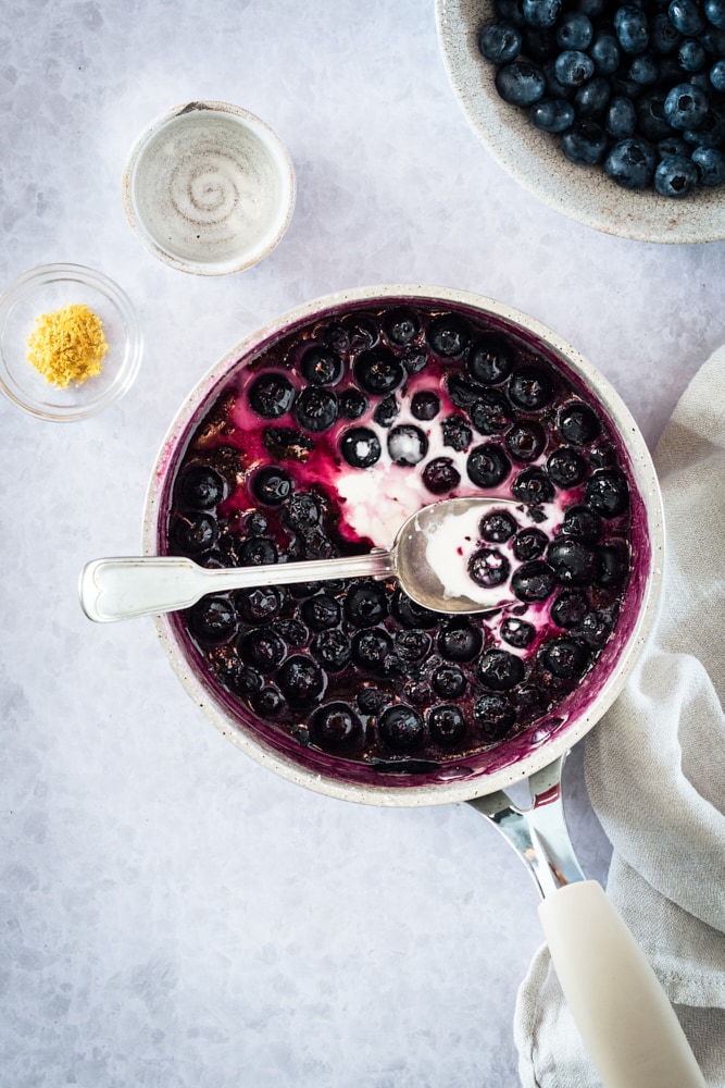 Overhead view of blueberry sauce in pan