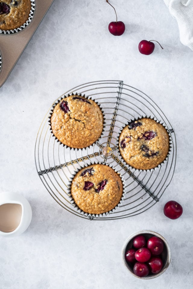 overhead view of Cherry Cheesecake Muffins on a small wire rack