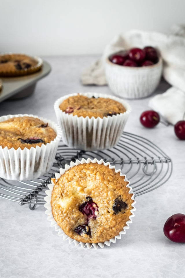 Cherry Cheesecake Muffins on a wire cooling rack
