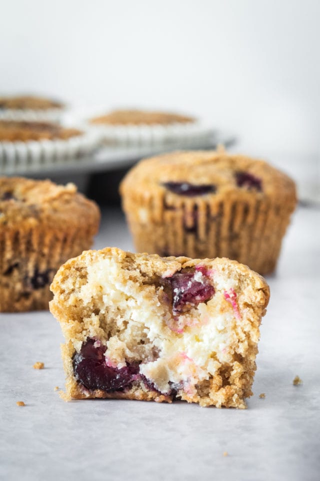 a Cherry Cheese Muffins cut in half to show the cream cheese filling