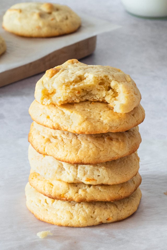 stack of Cream Cheese Macadamia Cookies on a gray surface