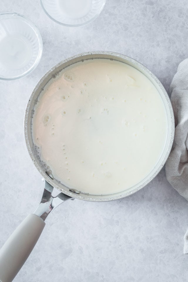 Overhead view of sugar and half-and-half in saucepan