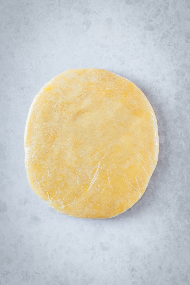 Overhead view of pastry crust before rolling