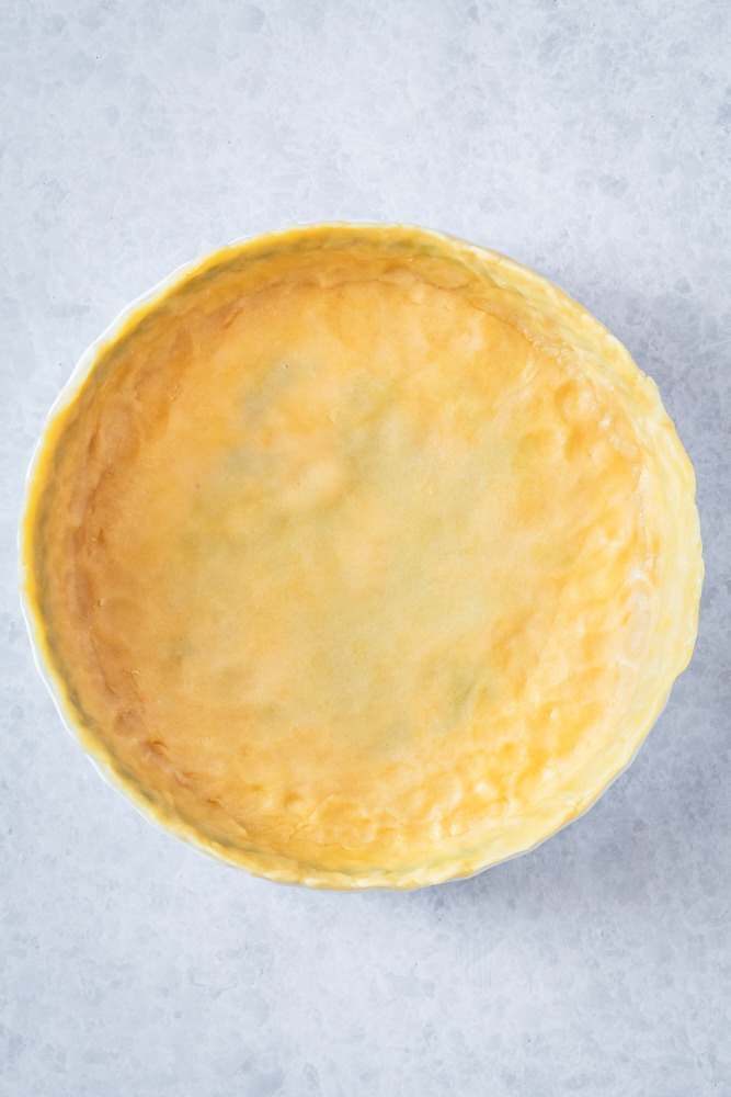 overhead view of unbaked crust in a pie plate