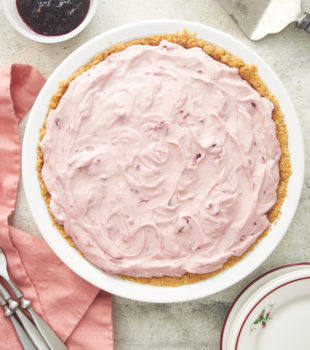 overhead view of No-Bake Cherry Cheesecake Pie in a white pie plate