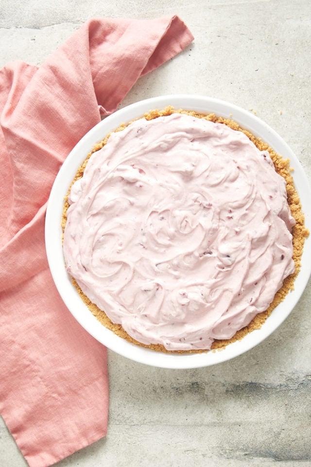 overhead view of No-Bake Cherry Cheesecake Pie in a white pie plate