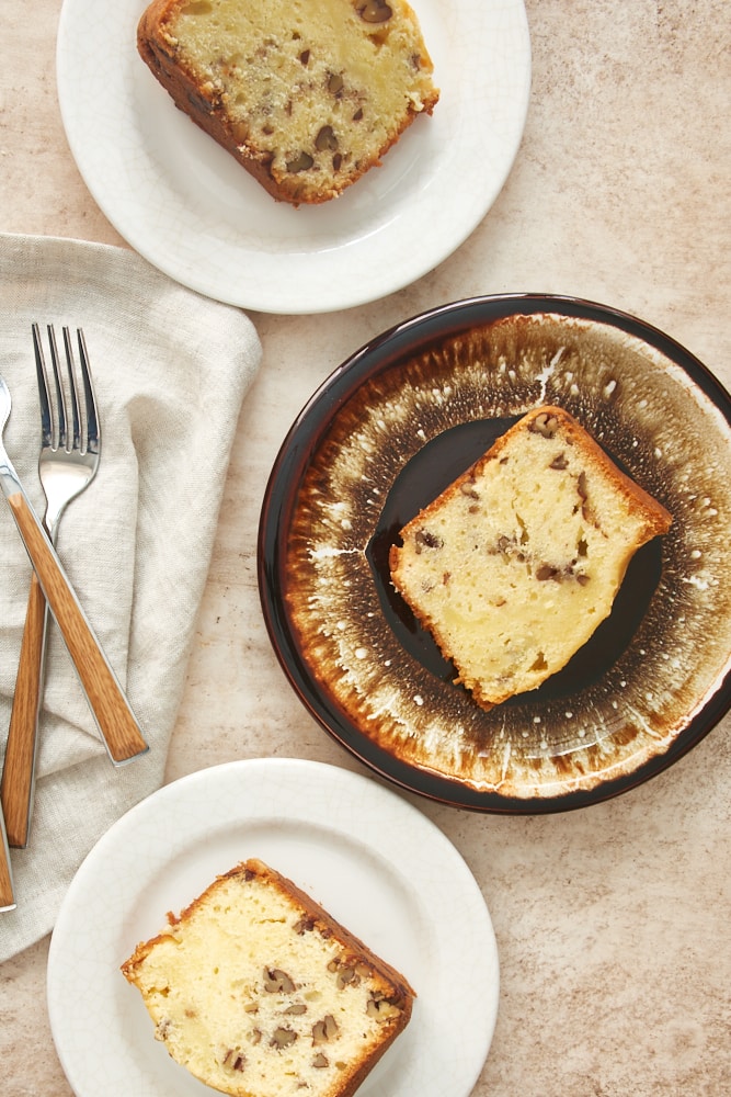 overhead view of slices of pound cake on white and brown plates