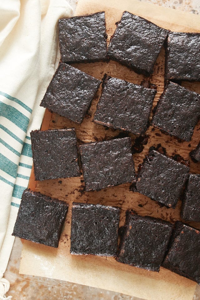 overhead view of Double Chocolate Zucchini Brownies on a wooden cutting board
