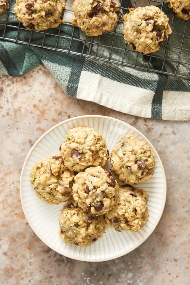 overhead view of Zucchini Oatmeal Chocolate Chip Cookies on a white and beige plate