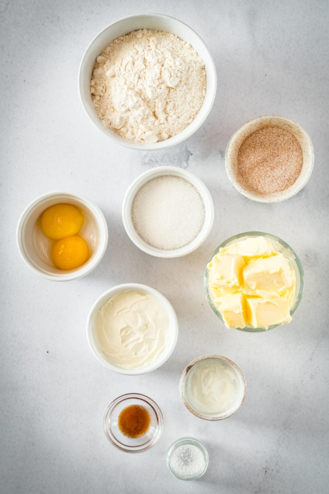 ingredients for Cheesecake Thumbprint Cookies, including flour, butter, cream cheese, and eggs