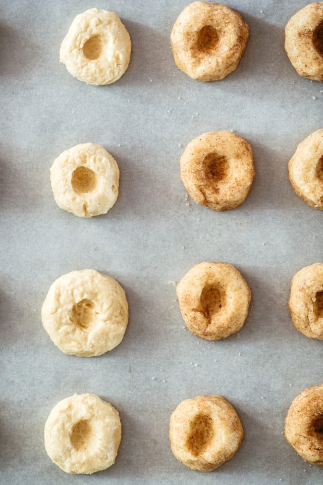 thumbprint cookies on a baking sheet ready to be baked