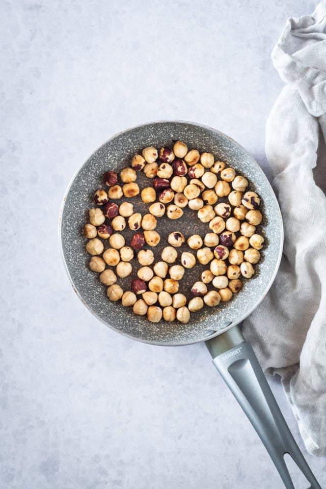 toasting hazelnuts in a skillet